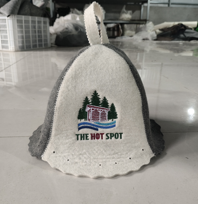 Custom embroidered wool sauna hat with a sauna studio logo